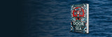 Banner for The Door on the Sea, with a stock photo of the sea in the background and a mockup of the book in physical format on top