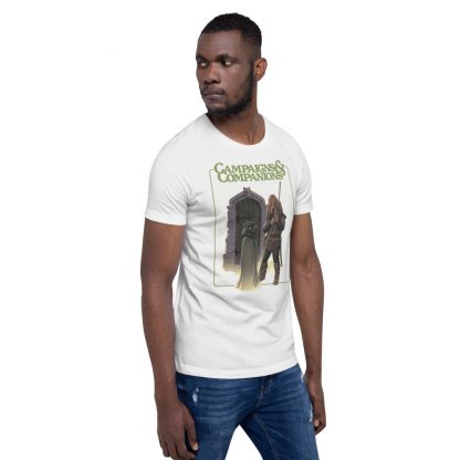 Male model wearing a white t-shirt featuring the cover of Campaigns & Companions including a fantasy cat and dog
