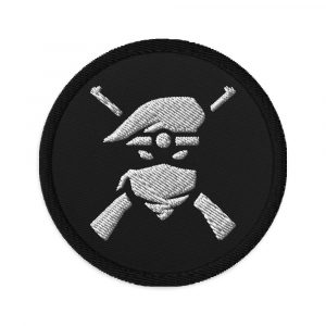 Image of a Black embroidered patch with white logo of person wearing beret and crossed rifles