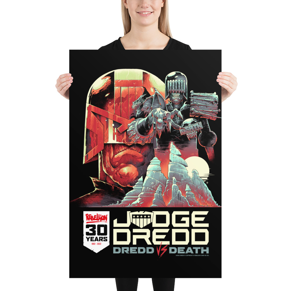 A large portrait poster in black. There is a white banner bottom left with the Rebellion logo in red, '30 YEARS' in black caps and '1992-2022' in Red. Bottom left are the words 'JUDGE DREDD, DREDD VS DEATH' and the main poster image is of Dredds helmeted face alongside Judge Death who reaches out over mountains.