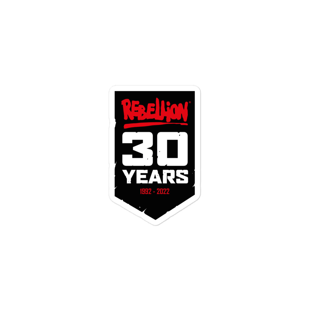 A black banner shaped sticker with the red Rebellion logo at the top, '30 YEARS' in white caps in the middle and '1992-2022' in red at the bottom