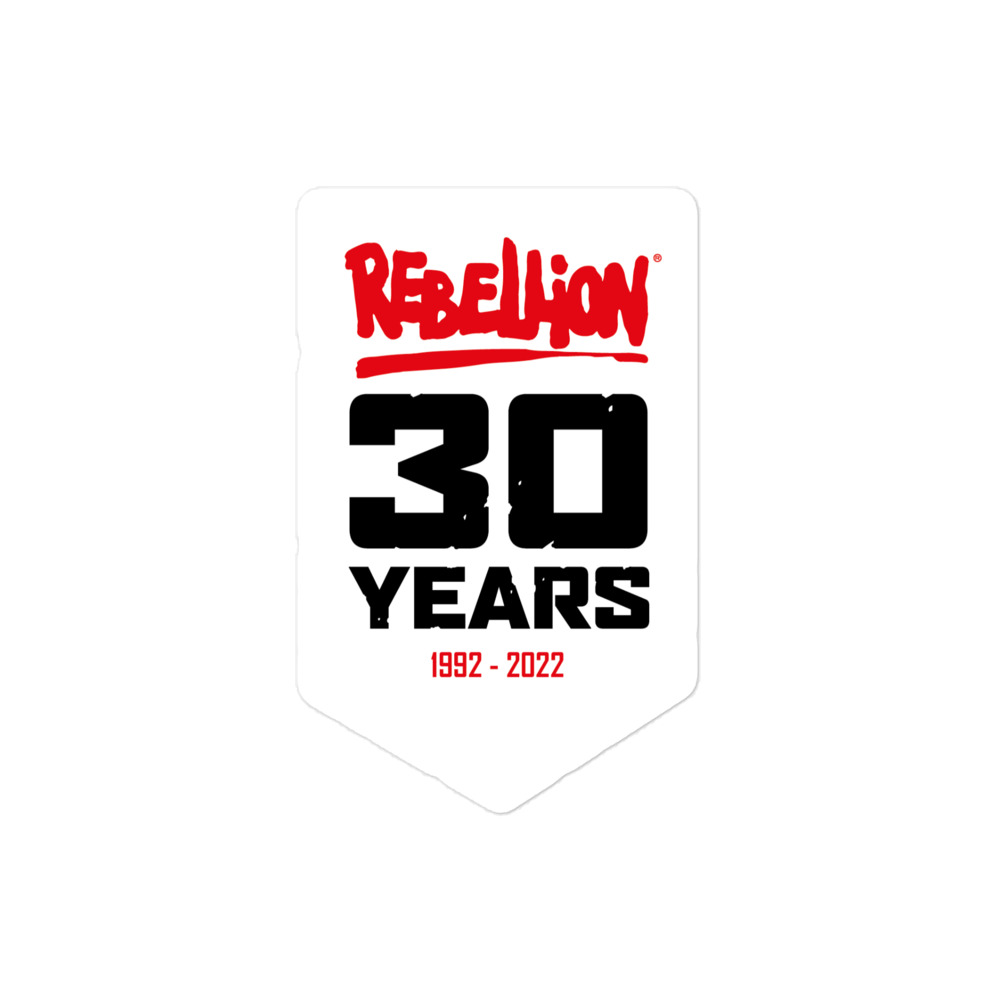 A white banner shaped sticker with the red Rebellion logo at the top, '30 YEARS' in black caps in the middle and '1992-2022' in red at the bottom