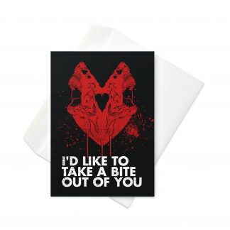 5 inch by 7 inch greetings card with zombie sharks forming a loving heart, with the words "I'd like to take a bite out of you" on a black background