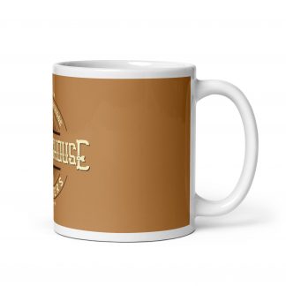 Side view of brown mug, you can see side of logo that reads "VARIABLE CARTRIDGE WESTINGHOUSE BLASTERS"